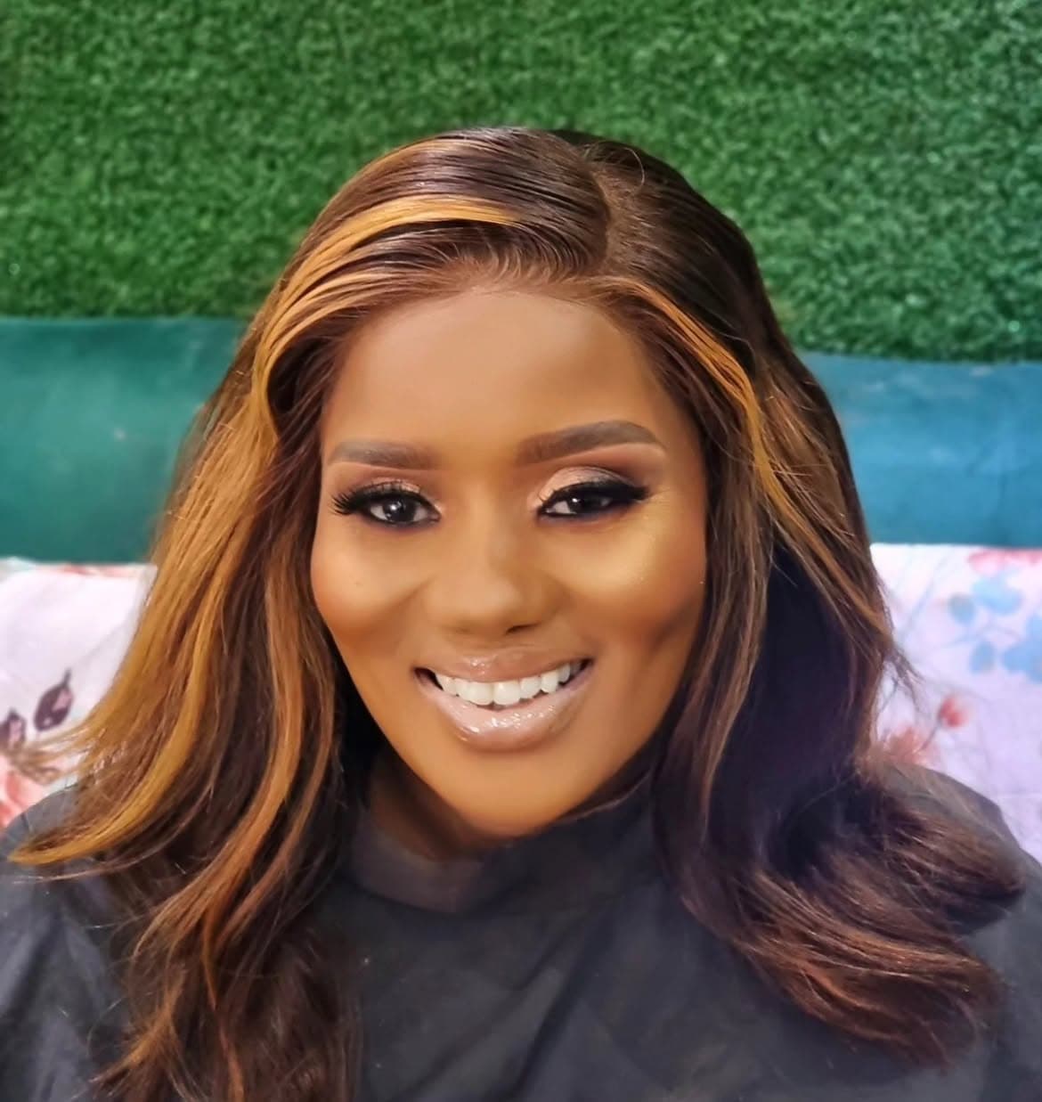Special occasion radiant makeup with caramel highlights and polished smile
