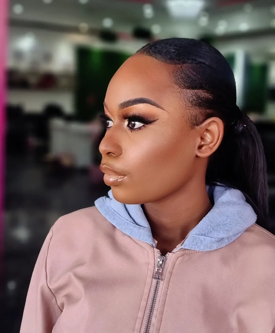 Youthful matric dance camera-ready glam with winged liner and sleek high ponytail