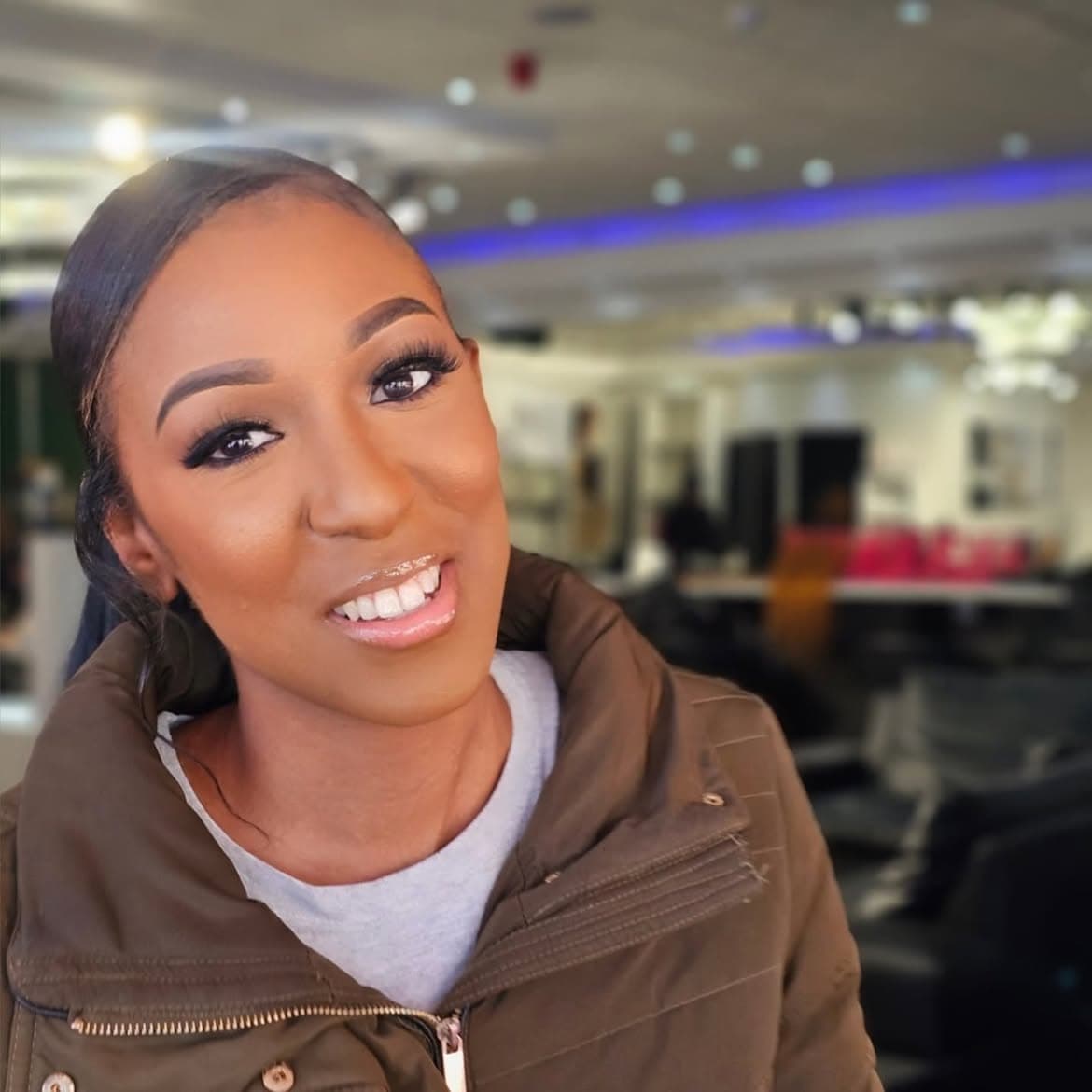 Radiant smile with natural wispy lashes and neutral everyday skin prep