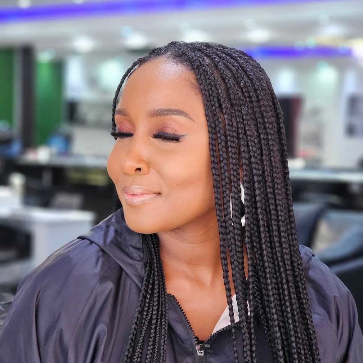 Relaxed salon setting showing velvet soft-focus eyeshadow blend and nude lip glaze